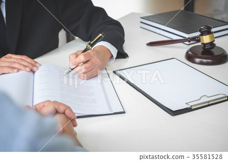 Close up of gavel, Male lawyer or judge Consult with client and 35581528
