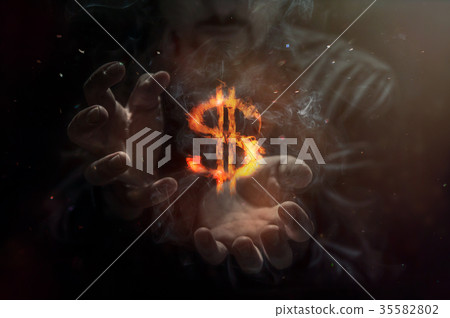 Burning symbol of dollar with man in background. Burning symbol of dollar with man in background. 35582802