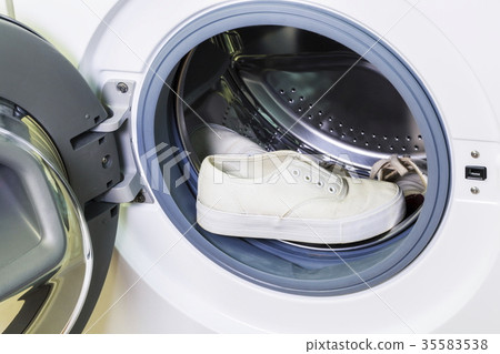Dirty white sneakers in washing machine Dirty white sneakers in washing machine 35583538