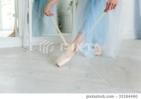 Ballerina puts pointe shoes Ballerina puts pointe shoes 35584460