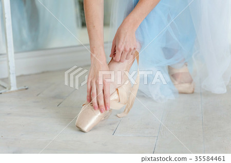 Ballerina puts pointe shoes Ballerina puts pointe shoes 35584461