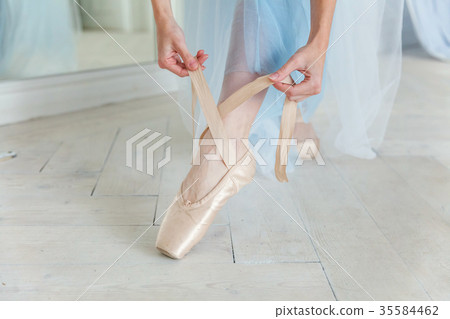 Ballerina puts pointe shoes Ballerina puts pointe shoes 35584462