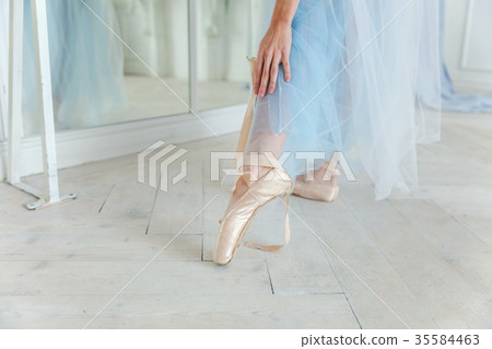 Ballerina puts pointe shoes Ballerina puts pointe shoes 35584463