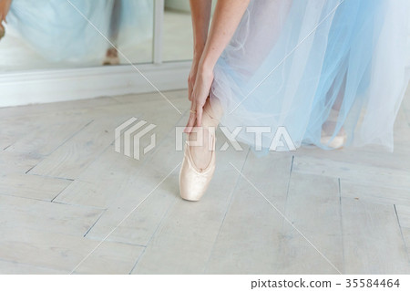 Ballerina puts pointe shoes 35584464