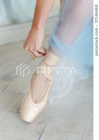 Ballerina puts pointe shoes Ballerina puts pointe shoes 35584468