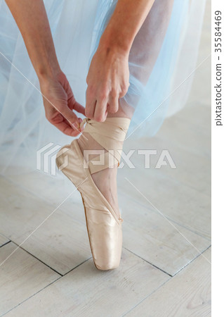 Ballerina puts pointe shoes Ballerina puts pointe shoes 35584469