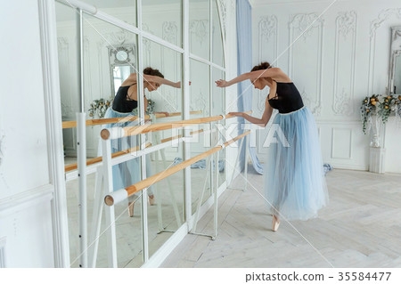 Young ballet dancer in dance class Young ballet dancer in dance class 35584477