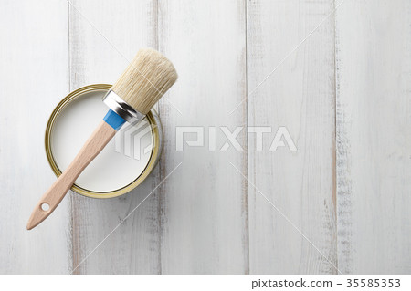 Paint brush and can on white wooden table Paint brush and can on white wooden table 35585353