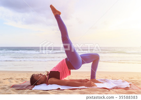 Woman playing Yoga and exercise on the tropical beach in Thailand 35588383