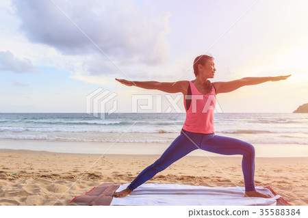 Woman playing Yoga and exercise on the tropical beach in Thailand 35588384