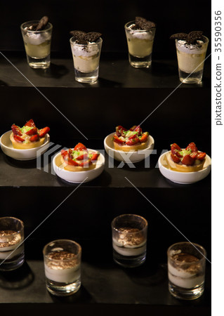 Assorted desserts on a buffet table 35590356