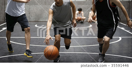 Man playing basketball dribbling 35591446