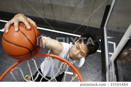 Men playing basketball 35591484