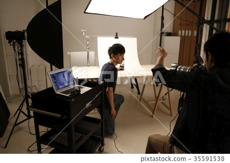 Photographer and assistant Photographer and assistant 35591538
