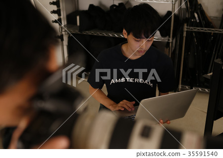 Photographer and assistant Photographer and assistant 35591540