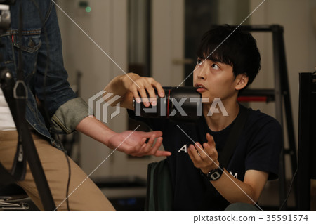 Photographer and assistant Photographer and assistant 35591574