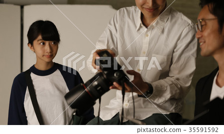 Photographer and assistant Photographer and assistant 35591592