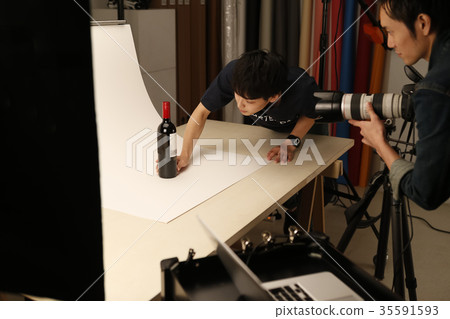 Photographer and assistant Photographer and assistant 35591593