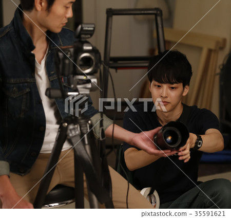 Photographer and assistant 35591621
