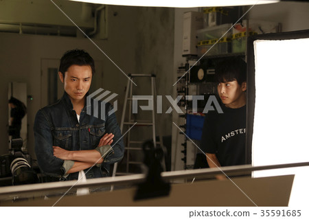 Photographer and assistant 35591685