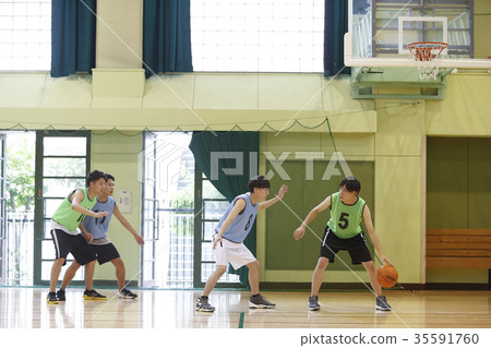 Man playing basketball dribbling Man playing basketball dribbling 35591760