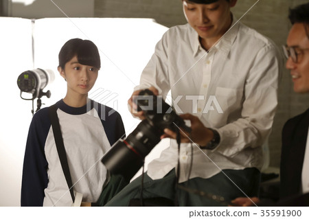 Photographer and assistant Photographer and assistant 35591900