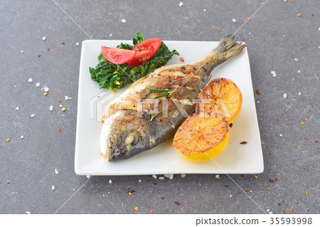 Grilled dorado with grilled , spinach and tomato Grilled dorado with grilled , spinach and tomato 35593998