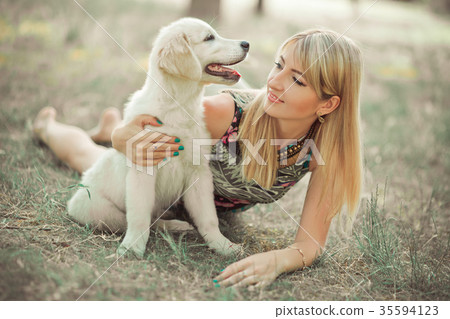 Retriever pup Lovely scene beautifull blond lady Retriever pup Lovely scene beautifull blond lady 35594123