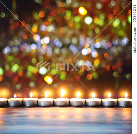 Burning candles on decoration background. 35595251