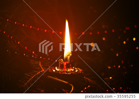 Burning candle flame 35595255