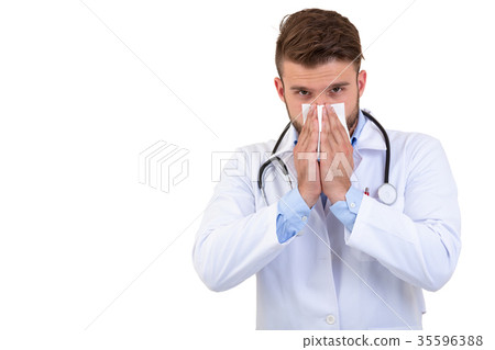 Young Doctor sneezing isolated against white Young Doctor sneezing isolated against white 35596388