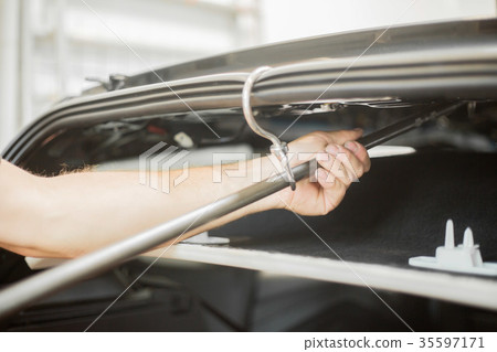 Repairing dents in a car Repairing dents in a car 35597171