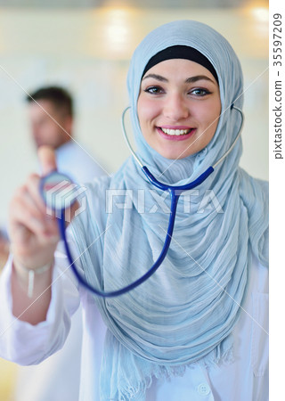 Confident Muslim doctor with hijab or medical Confident Muslim doctor with hijab or medical 35597209