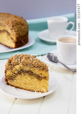 Cinnamon crumble coffee cake and cup of tea white 35597477