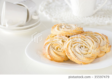 Round shortbread cookies rose form with icing Round shortbread cookies rose form with icing 35597479