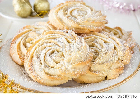 Closeup shortbread cookies rose form with icing 35597480