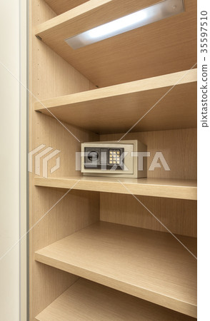 Safe box for storing valuables in a wooden Safe box for storing valuables in a wooden 35597510