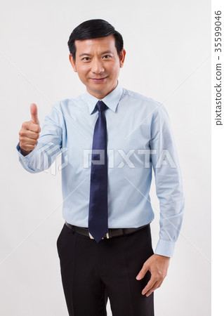 businessman pointing up thumb up gesture businessman pointing up thumb up gesture 35599046