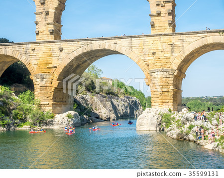 Touists at Pont du Gard in Nimes, France Touists at Pont du Gard in Nimes, France 35599131