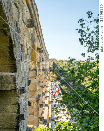 Touists at Pont du Gard in Nimes, France Touists at Pont du Gard in Nimes, France 35599159