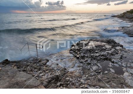 Stormy rocky beach sunset, coast of Adriatic Sea Stormy rocky beach sunset, coast of Adriatic Sea 35600847