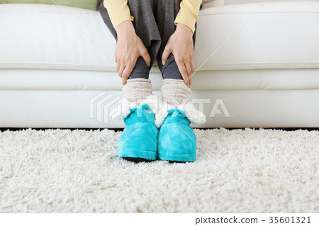 Woman wearing room shoes Woman wearing room shoes 35601321