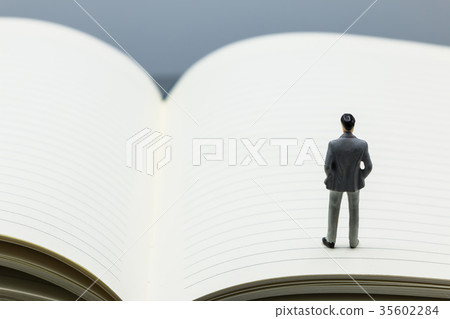 small figures businessmen stand on Blue Notebook small figures businessmen stand on Blue Notebook 35602284
