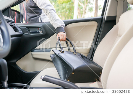 Woman burglar steal a shoulder bag through window Woman burglar steal a shoulder bag through window 35602428