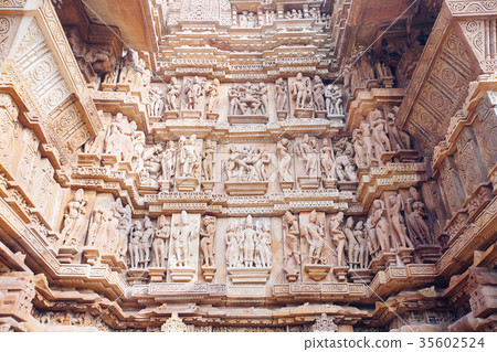 Ancient bas-relief at temple in Khajuraho, India. 35602524