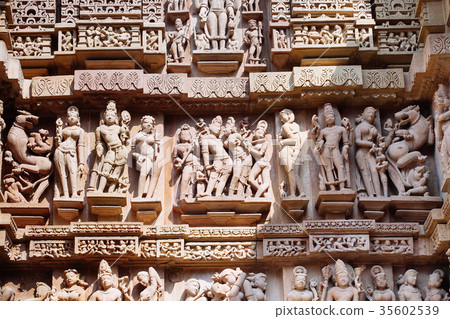 Ancient bas-relief at temple in Khajuraho, India. 35602539