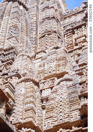 Ancient bas-relief at temple in Khajuraho, India. Ancient bas-relief at temple in Khajuraho, India. 35602540