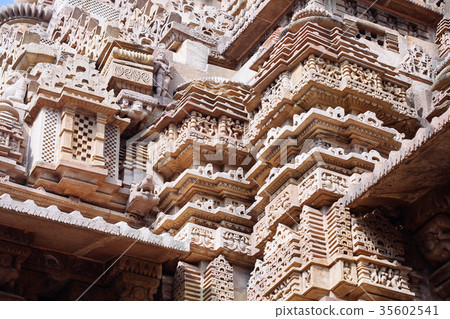 Ancient bas-relief at temple in Khajuraho, India. Ancient bas-relief at temple in Khajuraho, India. 35602541