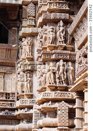 Ancient bas-relief at temple in Khajuraho, India. Ancient bas-relief at temple in Khajuraho, India. 35602542