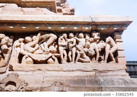 Ancient bas-relief at temple in Khajuraho, India. 35602545